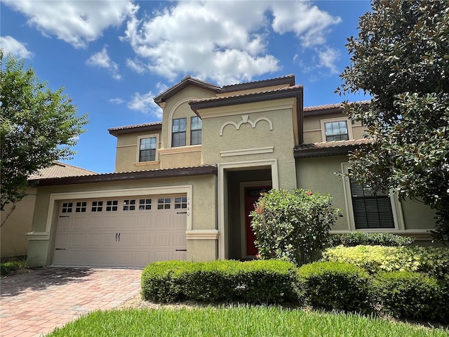 mediterranean / spanish-style house featuring a garage