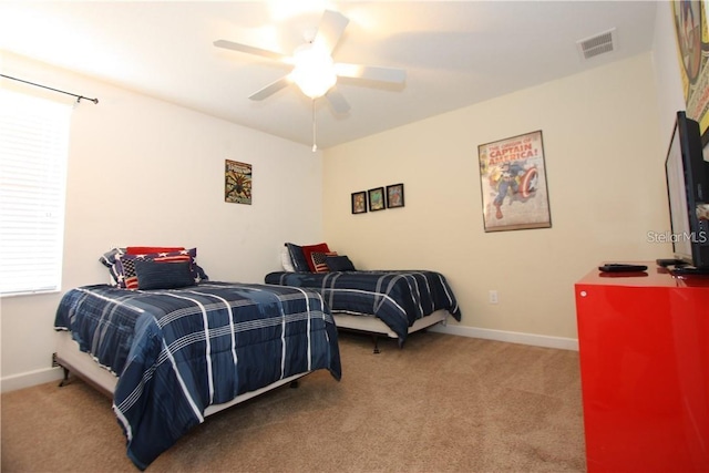 carpeted bedroom featuring ceiling fan