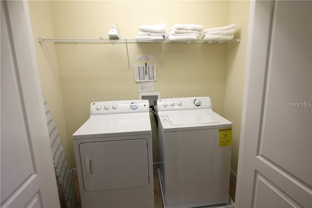 laundry room with separate washer and dryer