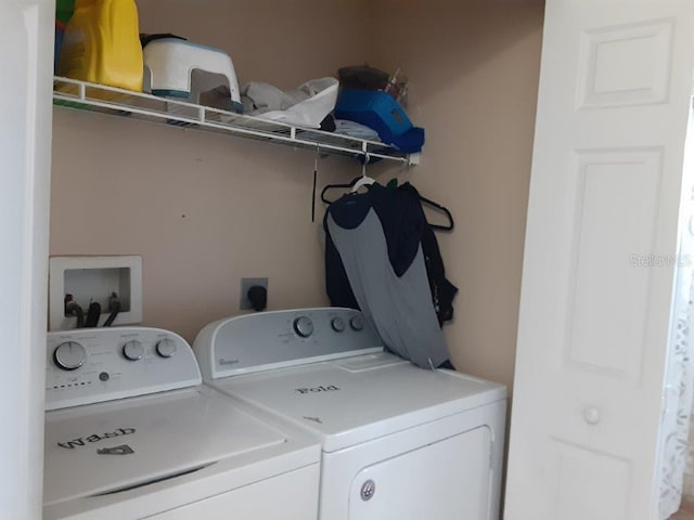 washroom with washer and clothes dryer