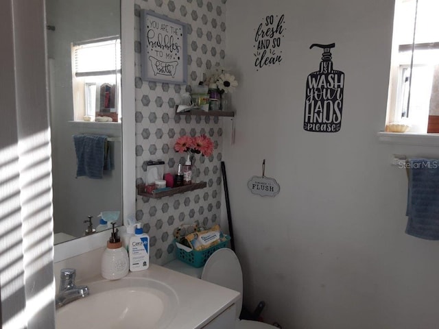 bathroom with vanity and toilet