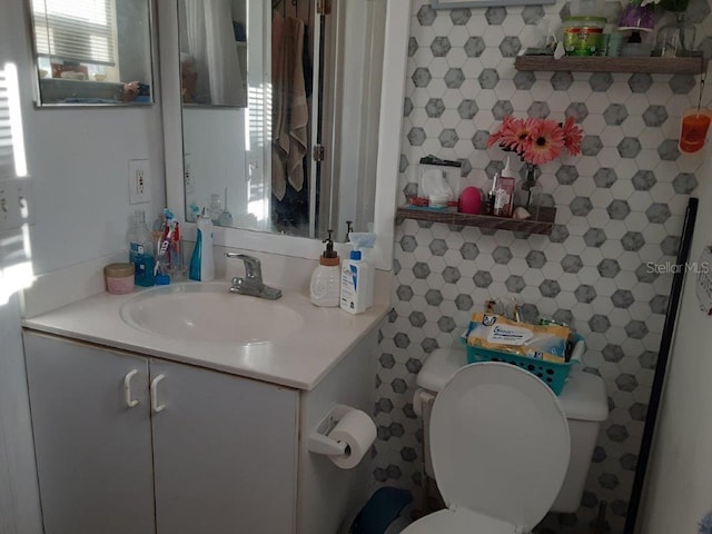 bathroom with vanity and toilet