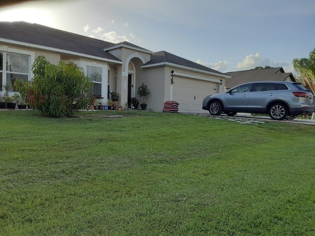 ranch-style home with a garage and a front lawn