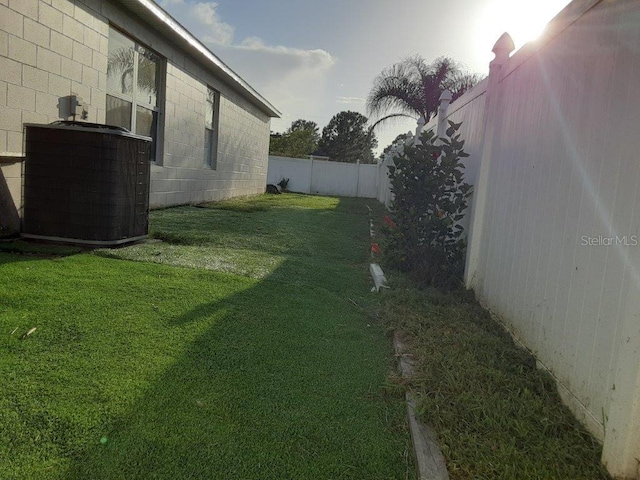 view of yard featuring central AC