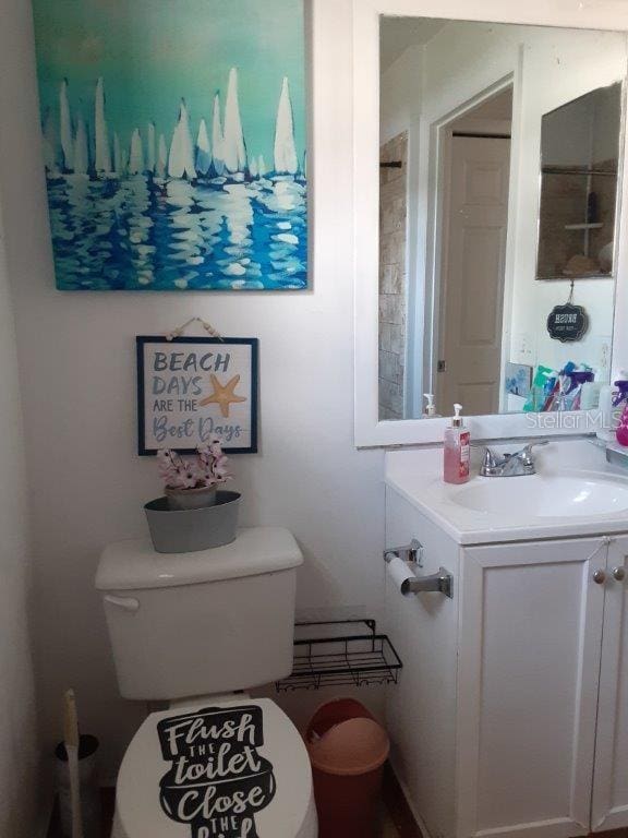 bathroom with vanity and toilet