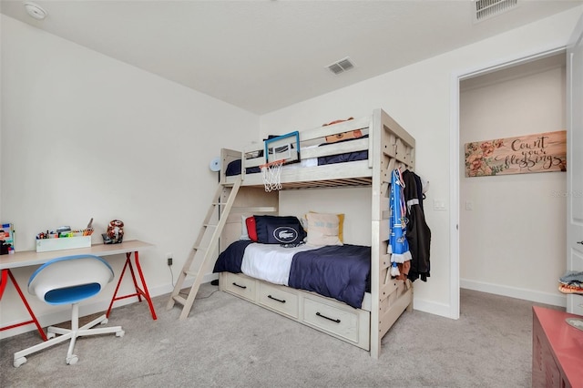 bedroom featuring light colored carpet