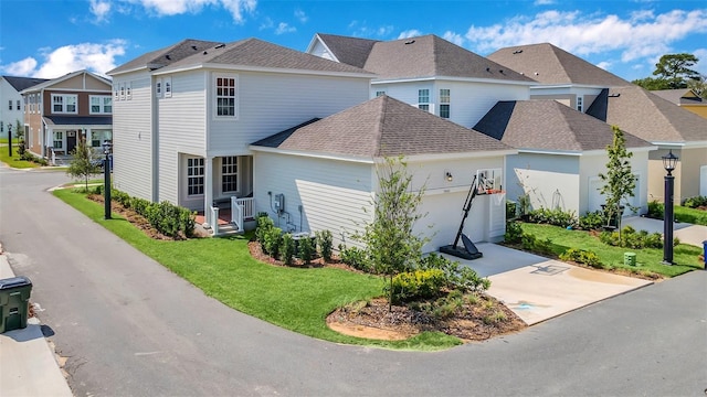 view of front of home featuring a garage and a front yard