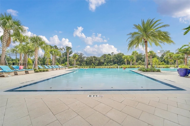 view of swimming pool with a patio area