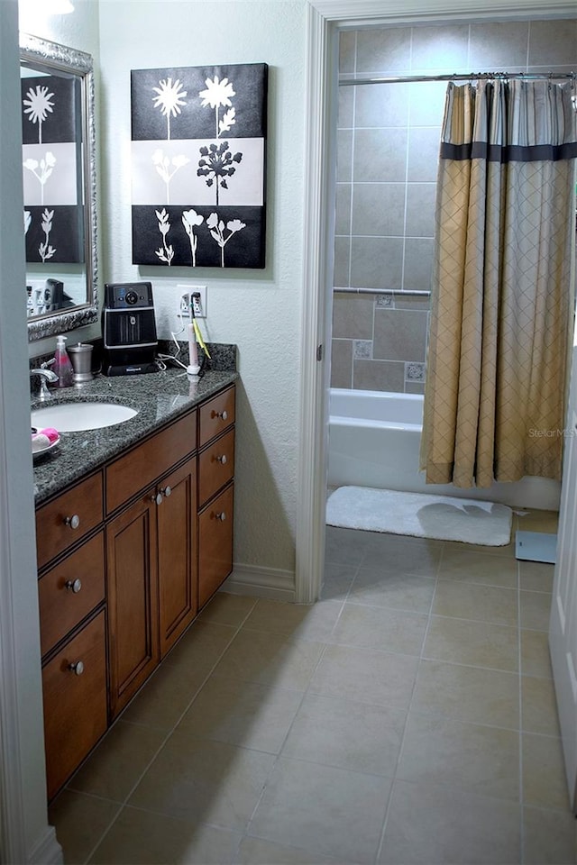 bathroom with shower / tub combo, tile floors, and vanity