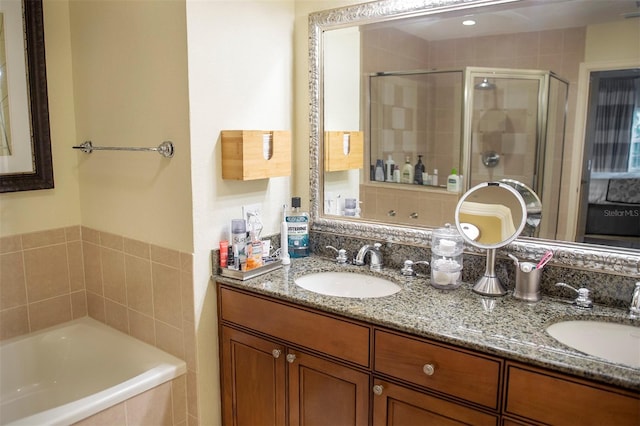 bathroom featuring dual vanity and plus walk in shower