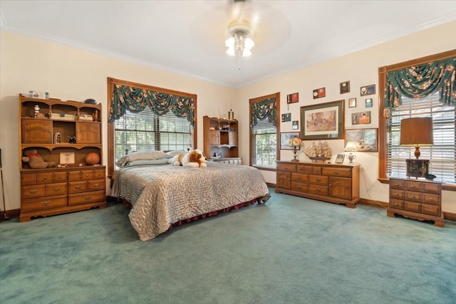 carpeted bedroom featuring ornamental molding and ceiling fan