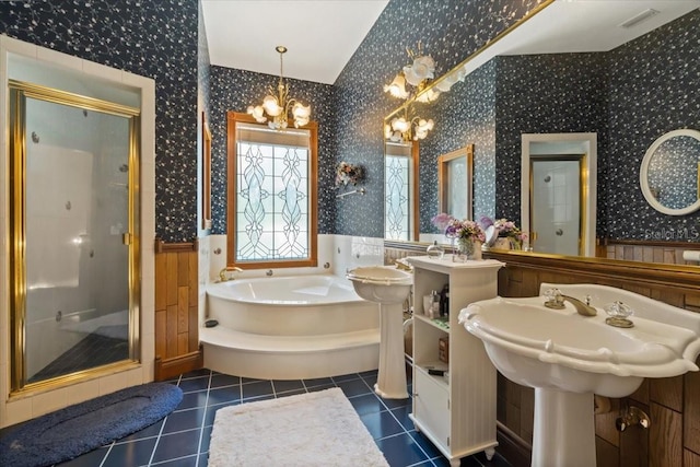 bathroom featuring independent shower and bath, dual sinks, tile floors, and an inviting chandelier