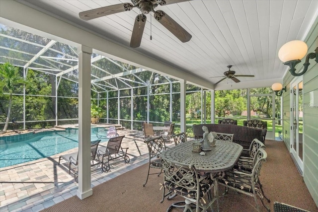 sunroom / solarium featuring wooden ceiling and ceiling fan