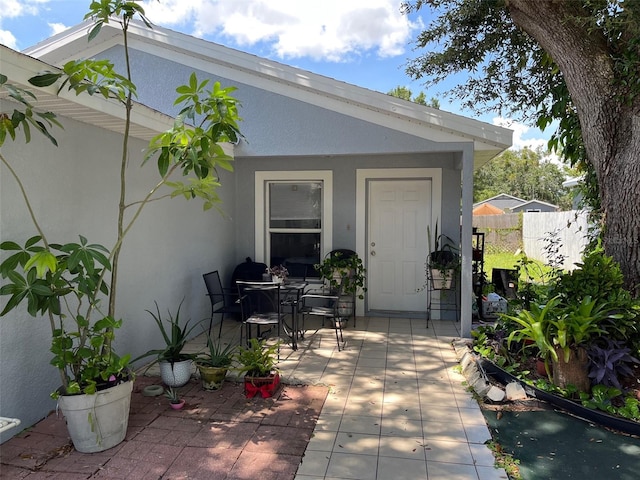 property entrance with a patio