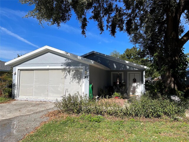 single story home featuring a garage