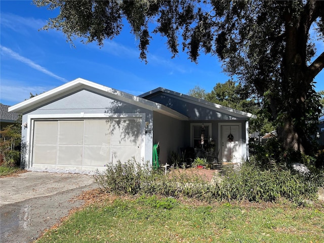 single story home with a garage