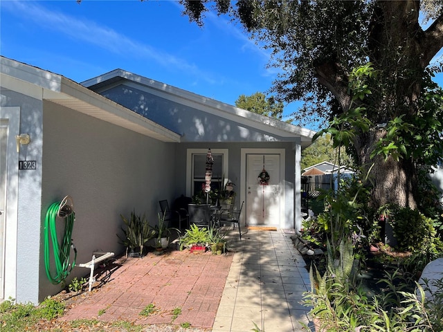 entrance to property with a patio area