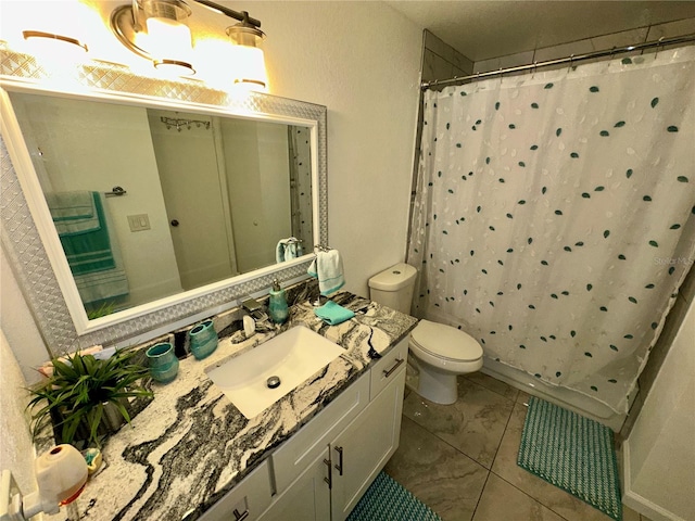 bathroom with toilet, tile flooring, and vanity