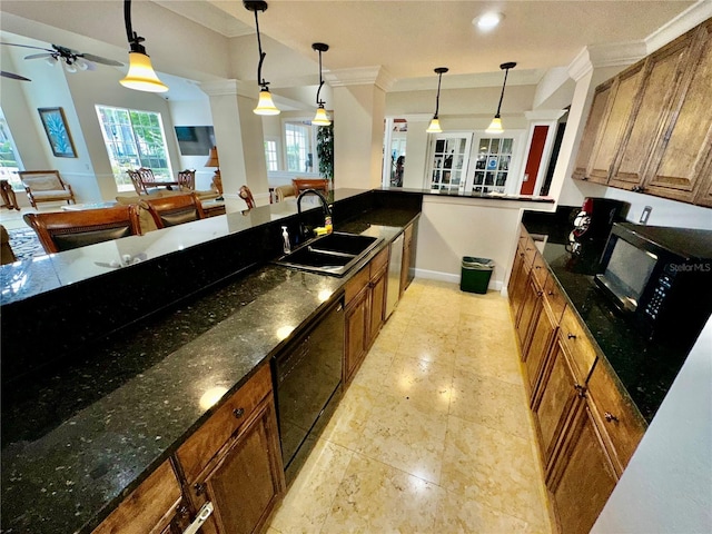 kitchen with decorative light fixtures, ceiling fan, sink, and light tile flooring