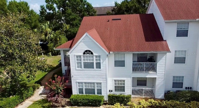 rear view of house featuring a balcony