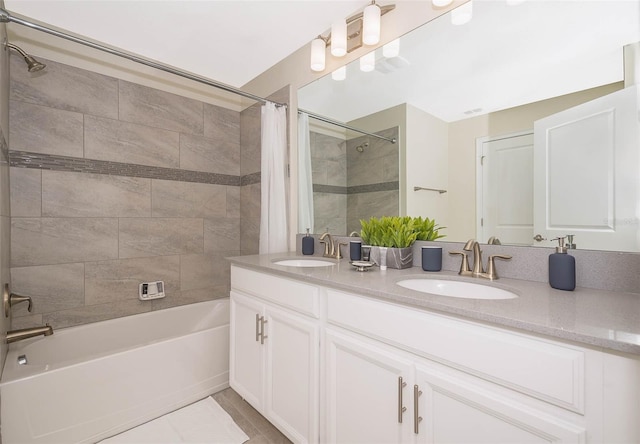 bathroom featuring shower / bath combo with shower curtain, dual vanity, and tile flooring