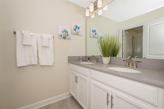 bathroom featuring walk in shower, tile flooring, dual sinks, and large vanity