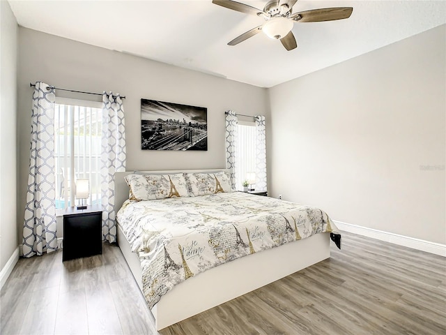 bedroom featuring ceiling fan and hardwood / wood-style flooring