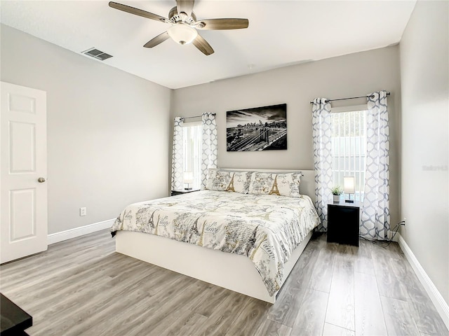 bedroom featuring ceiling fan and light wood-type flooring