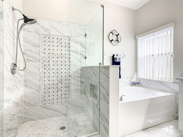 bathroom with independent shower and bath and tile floors