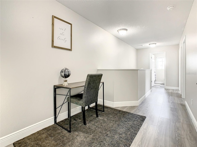 office area with light hardwood / wood-style floors