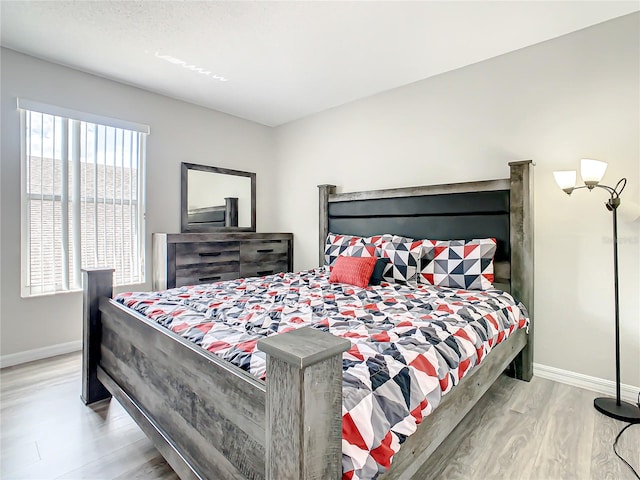 bedroom with light wood-type flooring