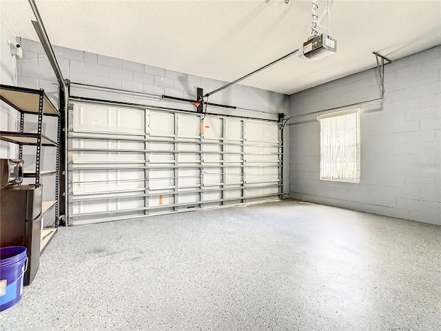 garage featuring a garage door opener