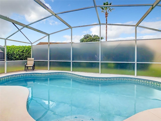 view of pool featuring a lanai