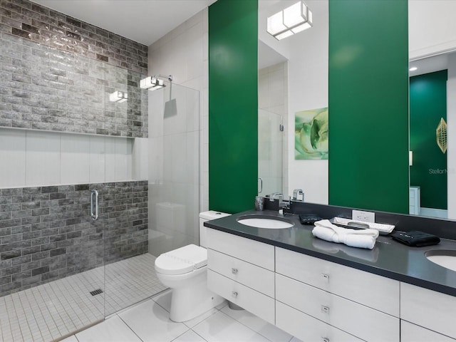 bathroom featuring toilet, double vanity, tile floors, and a shower with shower door