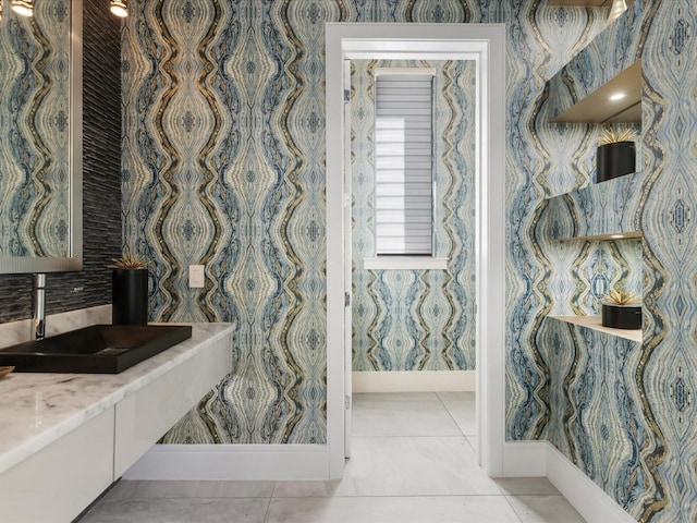 bathroom featuring tile floors and vanity