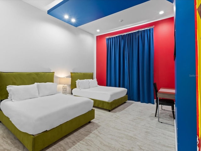 bedroom featuring light colored carpet