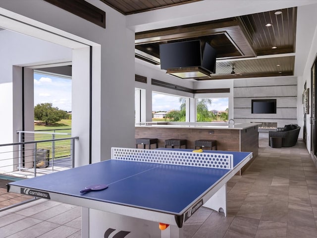 rec room featuring wood ceiling