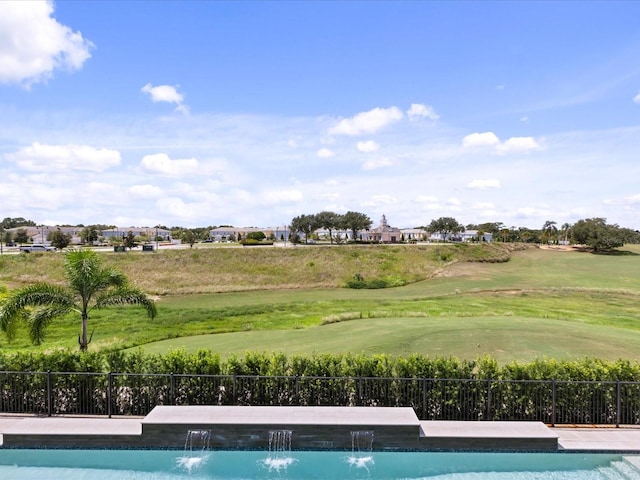 view of pool with pool water feature