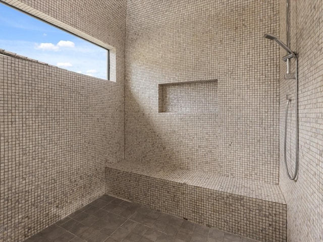 bathroom with tiled shower