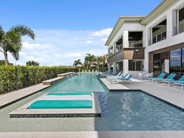 view of swimming pool featuring a patio area and pool water feature