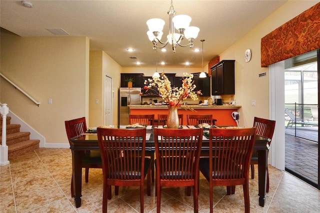 dining room featuring a notable chandelier and light tile flooring