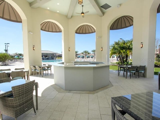 view of patio featuring area for grilling and exterior bar