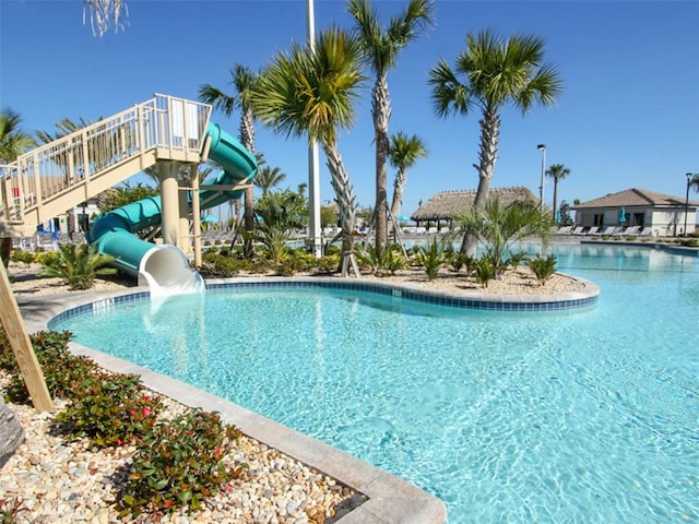 view of swimming pool featuring a water slide