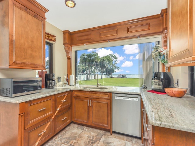 kitchen featuring kitchen peninsula, sink, appliances with stainless steel finishes, light tile flooring, and light stone countertops