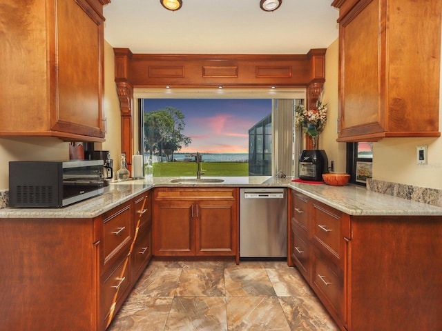 kitchen with light tile flooring, light stone counters, sink, and stainless steel appliances