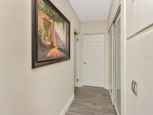 corridor featuring hardwood / wood-style floors