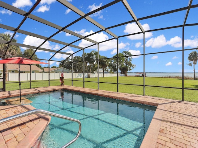 view of swimming pool featuring a lawn, a patio, and glass enclosure