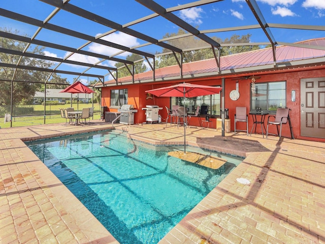 view of swimming pool with a grill, a lanai, and a patio