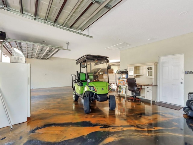 garage with white refrigerator