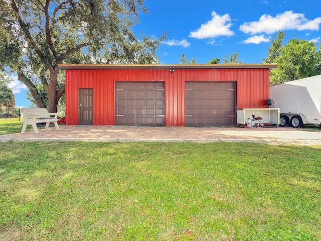 garage featuring a lawn